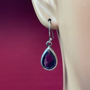 Vintage Sterling Silver teardrop shaped earrings with a faceted amethyst stone